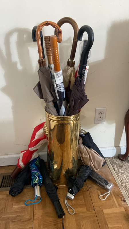 Brass Umbrella stand, and assorted umbrellas