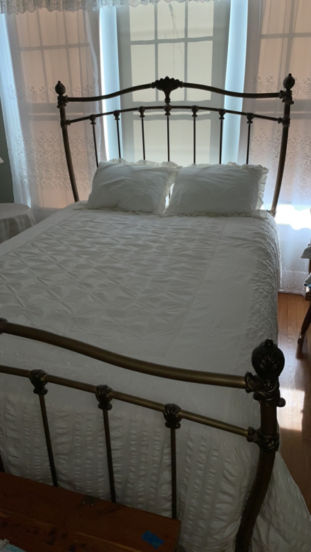 Brass Bed with Comforter and Two Pillows