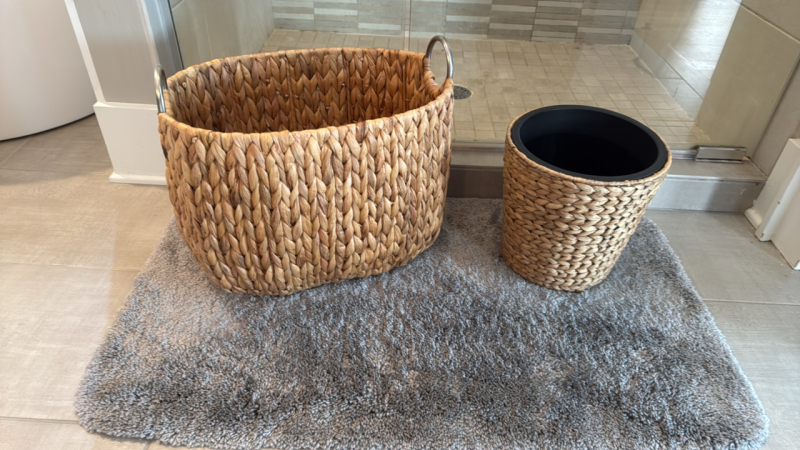 Grey Bathroom Rug, Wicker Towel Basket & Wicker Trash Bin