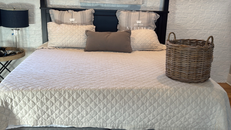 King-size Bedding, Atelier de Paris throw pillows, & wicker blanket basket
