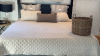 King-size Bedding, Atelier de Paris throw pillows, & wicker blanket basket