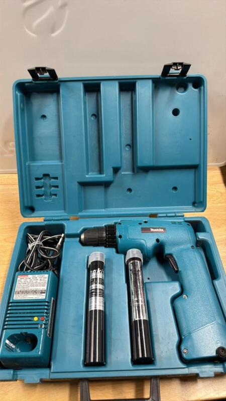 Makita drill with charger and two batteries and case