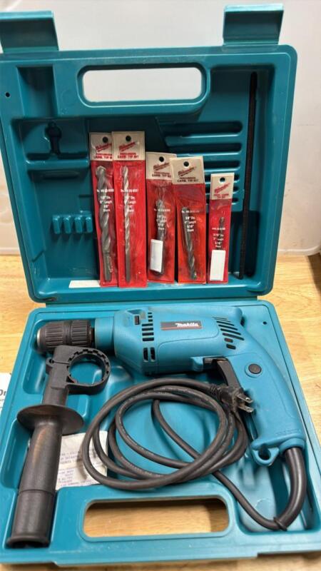 Makita hammer drill with bits and case
