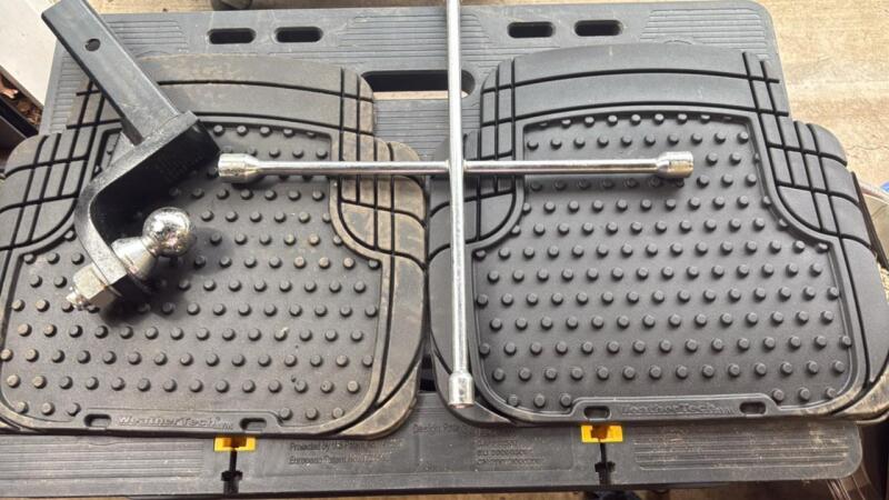 Two WeatherTech floor mats 2 inch receiver hitch four- way lug wrench