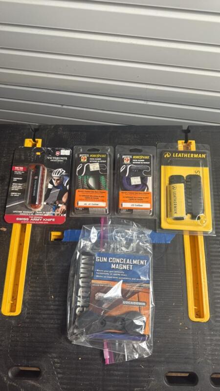 Firearms magnet, (2)bore snakes, Swiss Army knife, Leatherman Accessories