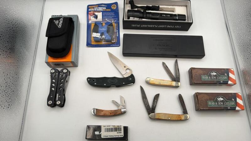Gerber multitool, knives, flashlight, whet stone, sharpener